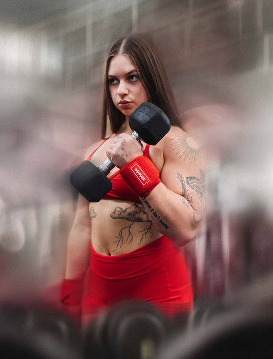 woman doing bicep curls with UPPPER wrist wraps