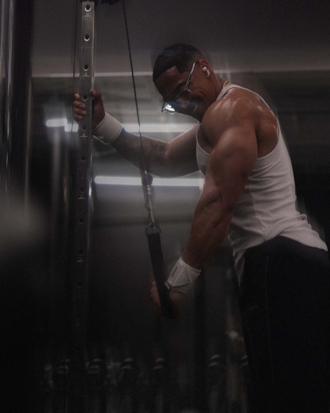 man doing unilateral exercise wearing uppper wrist wraps