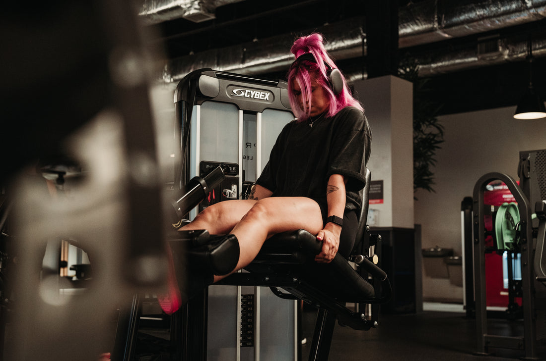 woman doing leg extensions